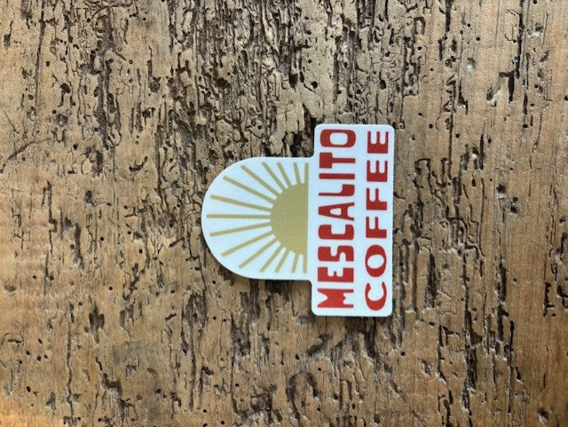 The Shop Stickers | Mescalito Coffee feature a gold sunburst and bold red "MESCALITO COFFEE" text, ideal for adding inspiration and rustic charm to your small-town coffee shop décor.